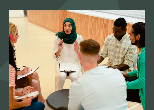 A group of people in a circle doing non profit consulting